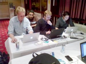 Other members of the NodeOne team collaborate in the coders' lounge