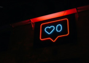 Neon sign mimicing the Instagram like counter